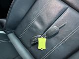 a car key with a yellow tag attached to it