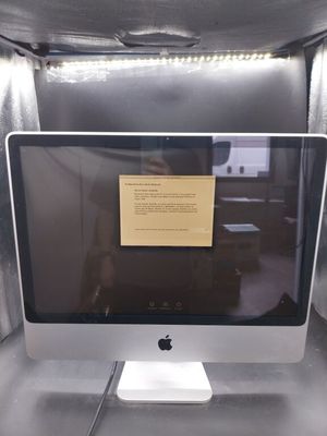 a computer monitor sitting on top of a desk