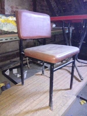 a chair that is sitting on a table in a room