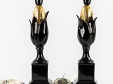 pair of black and gold corn lamps on black bases