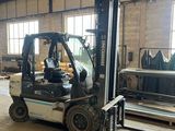a forklift truck that is parked inside of a building