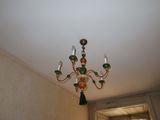 a chandelier hanging from the ceiling in a room
