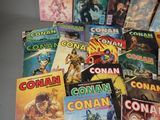 a lot of comic books that are on the table