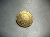 a close up of a gold coin on a table