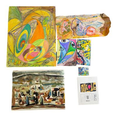 many different paintings on display on a white surface