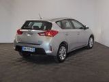 the back of a silver toyota yaris parked in a room