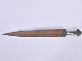 a knife that is laying on a white surface
