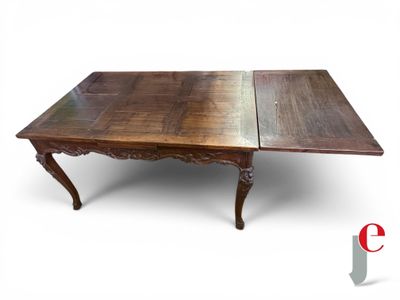 an image of a table with two leaves on top of it