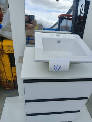 a white sink and a mirror in a room