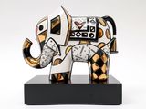 statue of an elephant with a clock on it ' s head on a stand