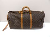 Sac Keepall Louis Vuitton en toile Monogram et cuir