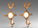 pair of antique wall sconces with mirrors and candles