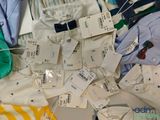 a pile of clothes and tags on a table