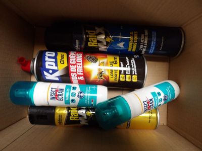 three different types of sprays in a cardboard box