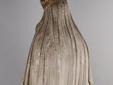 marble statue of a woman with a veil on her head