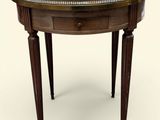 a round table with a marble top and wooden legs