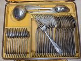 many spoons and spoons in a case on the floor