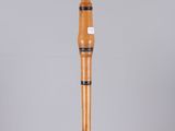an image of a wooden umbrella with a black stripe on it