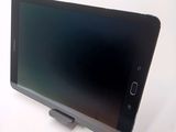 a tablet computer sitting on top of a table