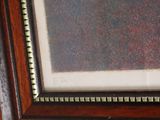 a picture of a picture in a frame hanging on a wall