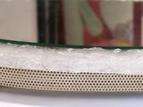 a glass bowl with bubbles on it sitting on a table