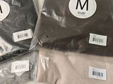 two bags of men ' s underwear sitting on top of a table