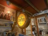 a picture of a store with a clock on the wall