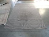 a picture of a room with a rug on the floor and a rug on the floor