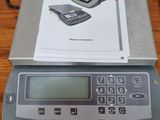 a digital scale on a table with a box on it