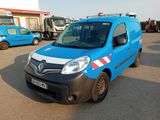a blue van that is parked in a parking lot