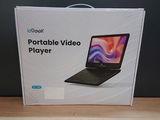 packaging for a portable video player in a box on a table