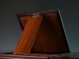 a wooden box that is open on top of a table