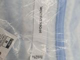 a label on the back of a blue shirt