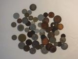 a pile of coins sitting on a white surface