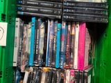a lot of dvds in a green box