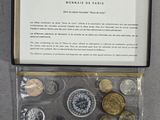 an image of a box of coins with a note in it