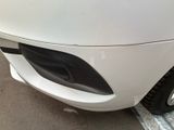 a close up of a car ' s front bumper