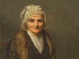 portrait d'une vieille femme assise sur une chaise, portant une étole en fourrure