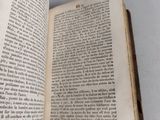 an open book that is sitting on a table