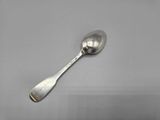 a close up of a spoon with a spoon handle on a table