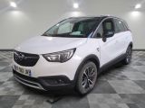 the white opel suv is parked in a room with a checkered floor