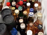many bottles of alcohol in a box on the table