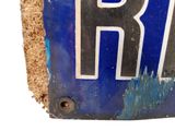 a close up of a blue and white plate with the word br on it