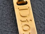 a picture of a gold pendant with the word hope on it