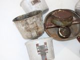 many pots and pans that are sitting on a table