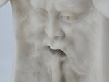 statue of a man with a goat ' s head and a goat ' s face