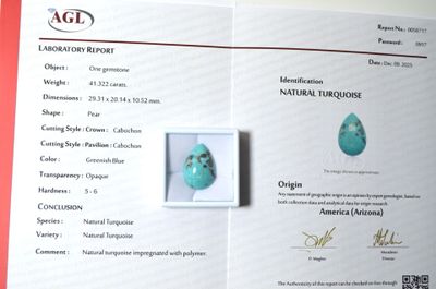 une photo d'un certificat sur laquelle figure une pierre turquoise