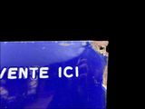 a blue sign with the word ente ci written on it