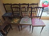 four chairs that are sitting next to each other in a room