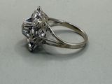 a ring with a diamond on it on a table
